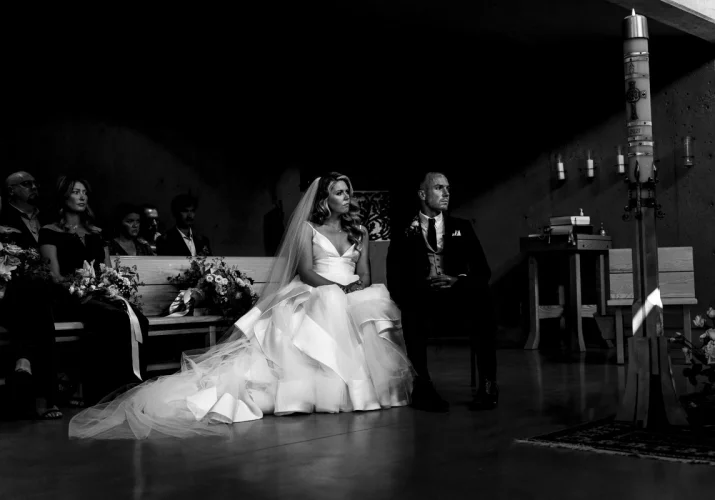 Bride and Groom are listing a reading durng Calgary Wedding Ceremony.