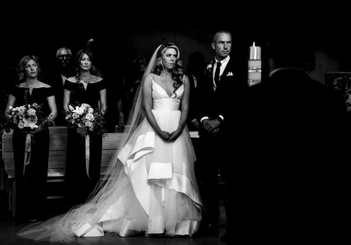 Bride and Groom praying in the church during their Calgary Wedding Ceremony