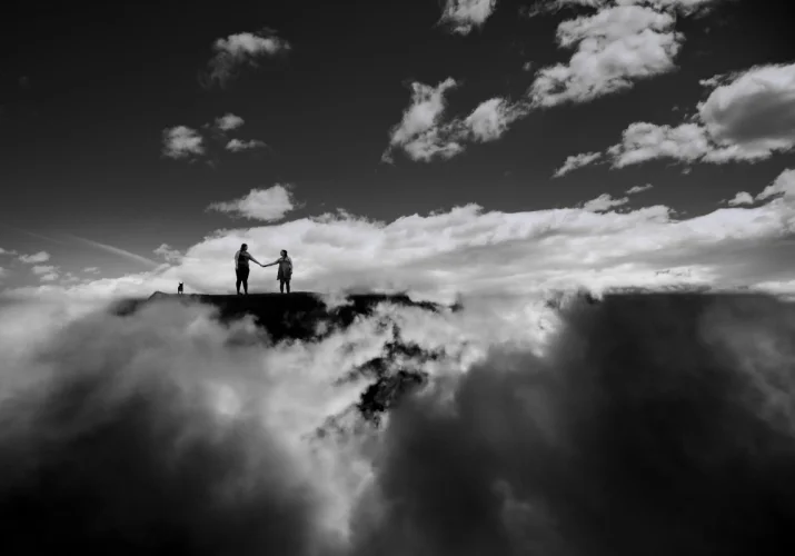 Creative Banff Engagement Photography. The couple in the clouds