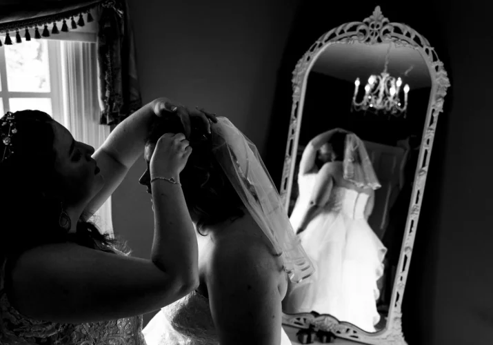 Bride is getting her hair done. Calgary Intimate Wedding .