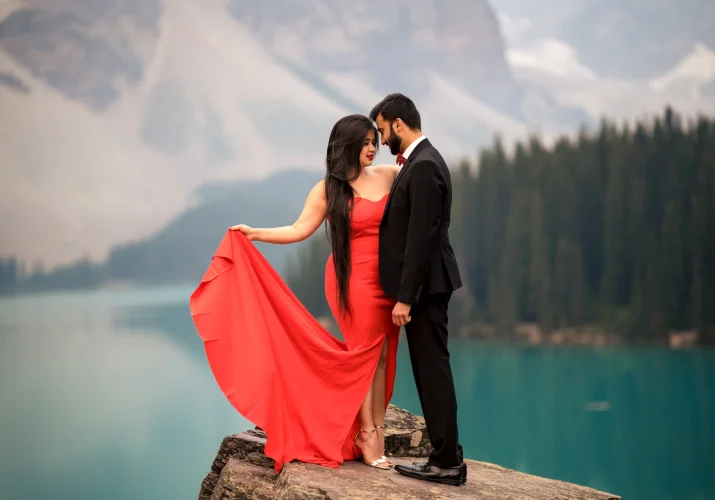 Handsome couple posing during their engagement photo session at Moraine Lake.