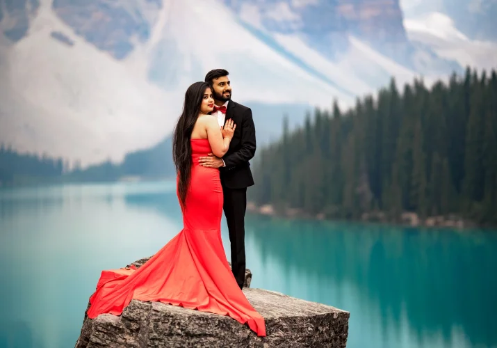 freshly engaged couple hugging each other at Moraine Lake. Banff Engagement Photogaphy.