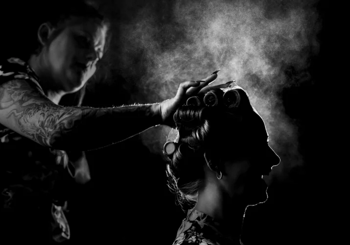 Hairdresser is spraying Brides hair before Wedding Ceremony in Calgary
