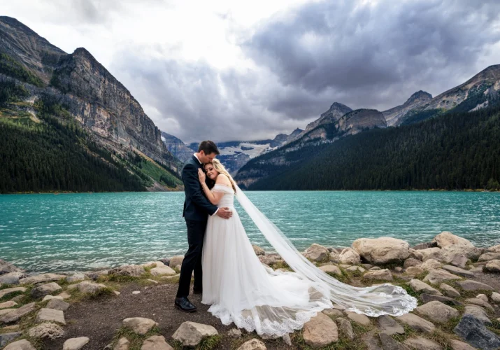 Groom and Bride holds each other during they wedding photo session captured by the best Banff Wedding Photographer.