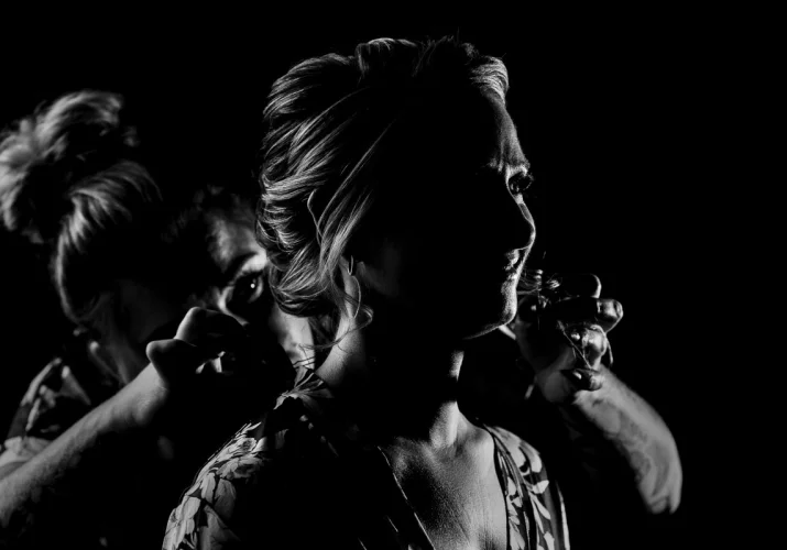 Hairdresser is working on the Bride's hair before Calgary Wedding