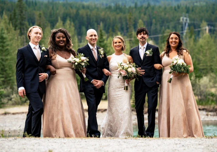 Bridal Party captured by the best Calgary Wedding Photographer. All quests are looking at the camera.