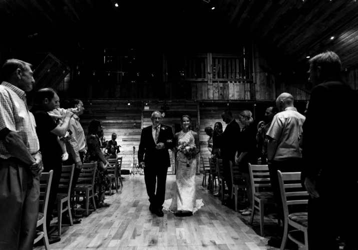 Father with the bride walking down the aisle