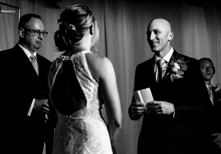 Groom is reading a vows