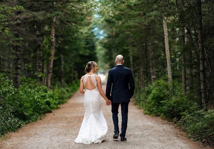 Newlyweds walking in the forest in Calgary