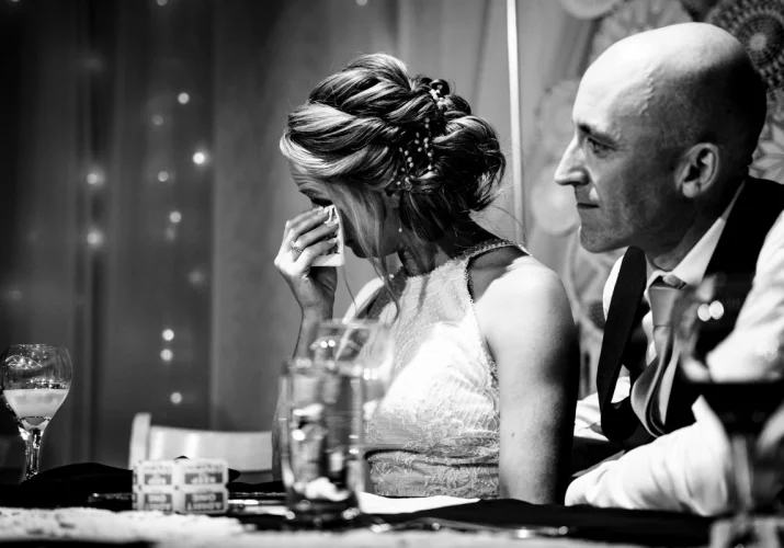 Moved bride is crying during the wedding speeches