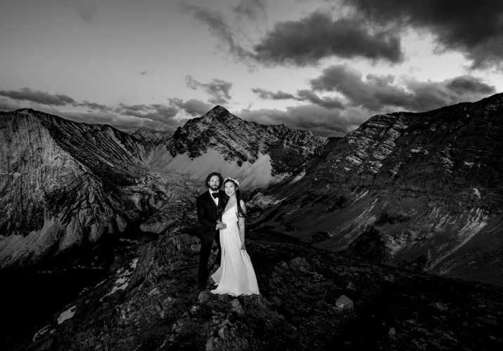 Black and white photography of fearless newlyweds in the Canadian Rockies.
