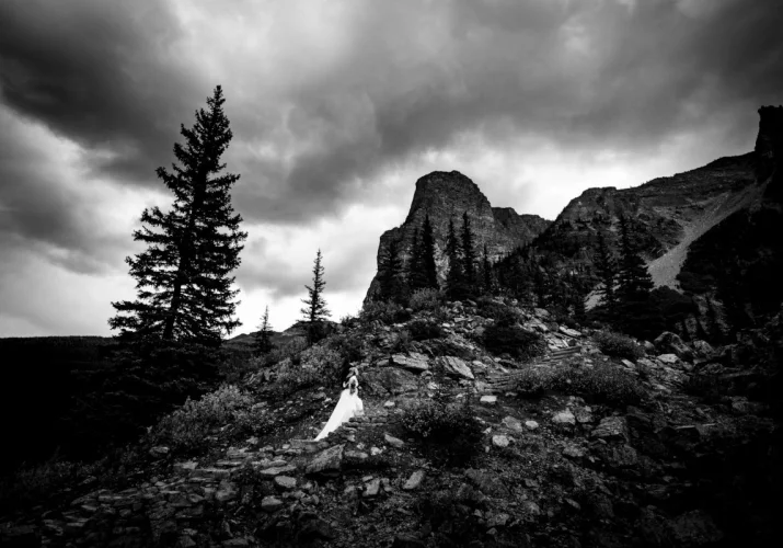 bride climbs the mountain in Banff National Park.