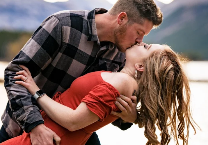 Man kisses his fiancee