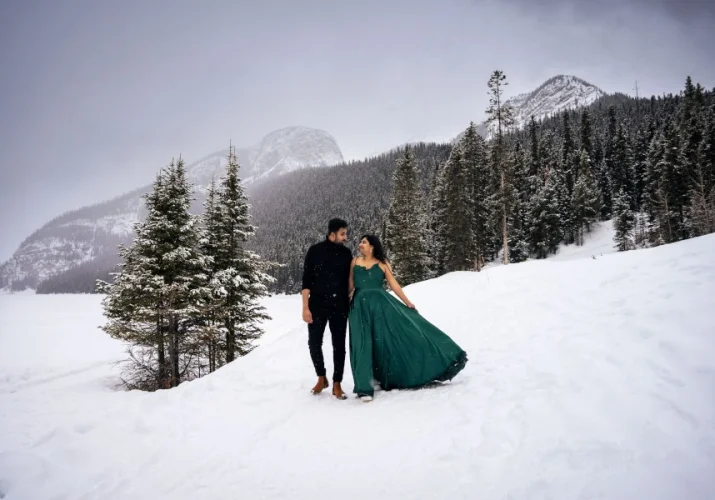 Indian couple walk in the mountains during wnter.