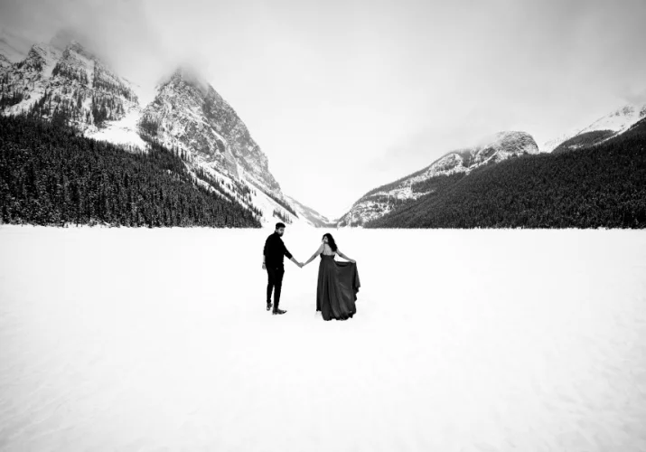 Gorgeous engagement photo session at Lake Louise in Banff during winter.