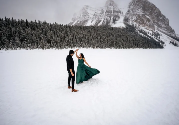 Indian couple dance in the snow.