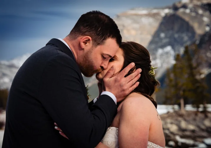 Groom kisses the bride.