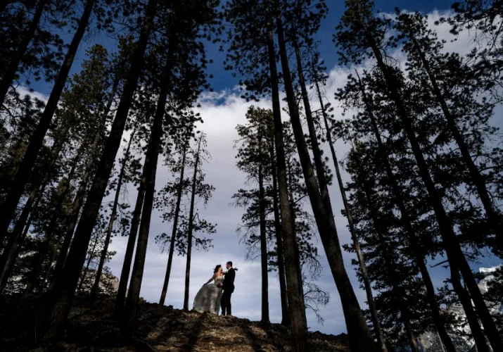 Bride and groom look deeply into each others eyes in the middle of nowhere