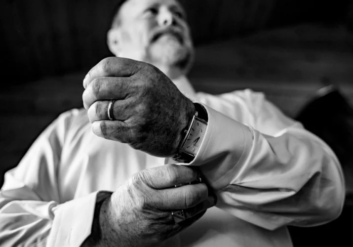 Groom's father in law getting ready for a wedding ceremony.