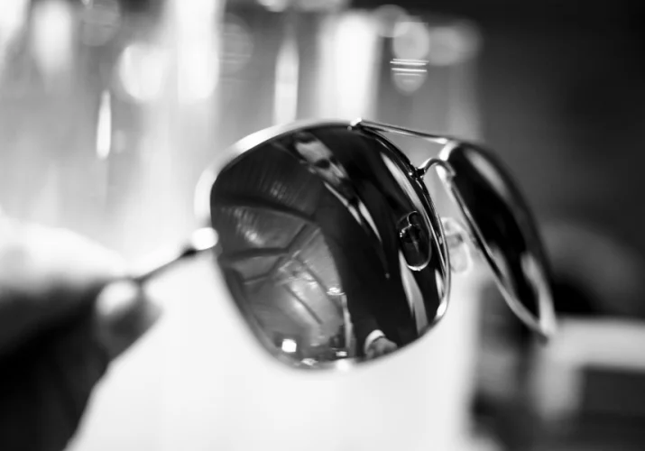 Groom's reflection in the sunglasses