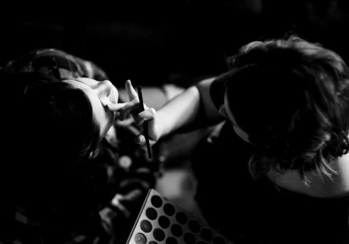 Make-up artist working on the bride's make up.