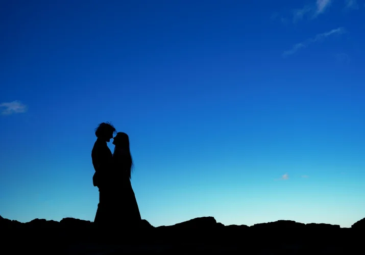 Silhouette picture of fleshly engaged couple in love.
