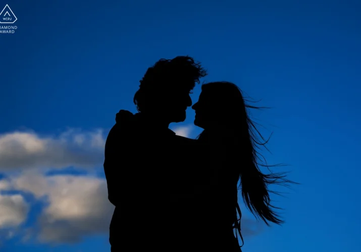 Silhouette couple hugging each other.