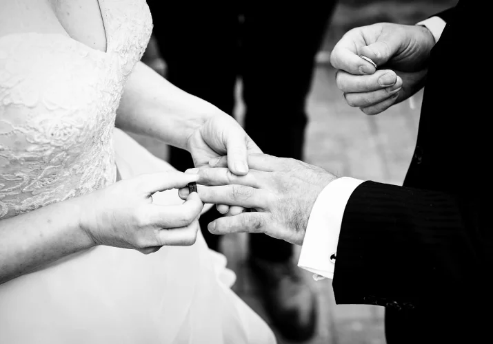 Wedding ring exchange in black and white