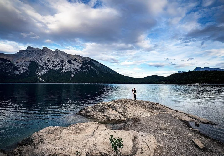 Newlyweds in a big environmental shoot at Minnewanka Lake in Banff.