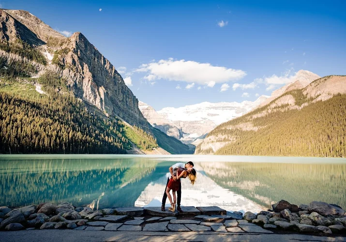 Banff Wedding Photography by the Lake Louise of couple kissing in stunning scenery.
