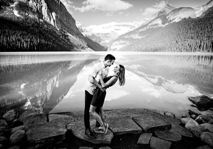 Engaged Photography of dancing couple by Lake Louise.