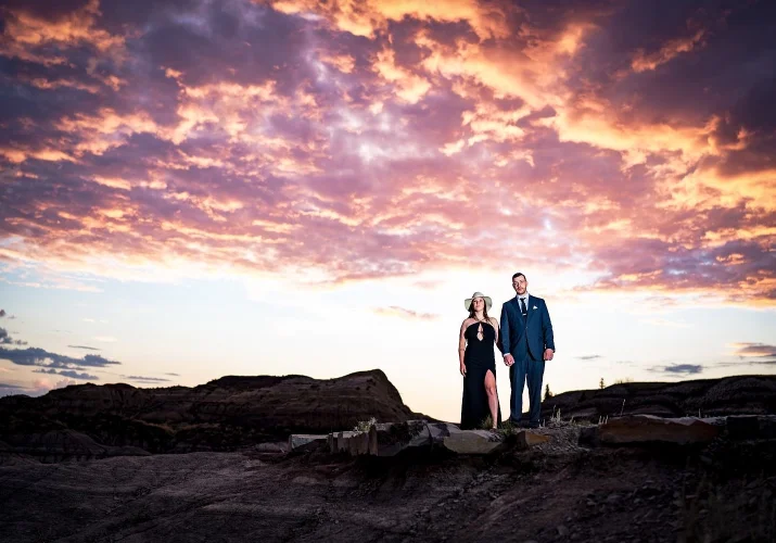 After-wedding portrait in the Canadian Badlands during colourful sunrise.