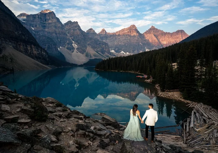 engaged couple adore the view of Moraine Lake.