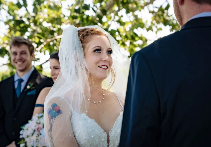 Bride looks deeply into the groom eyes during the Calgary Wedding Ceremony.