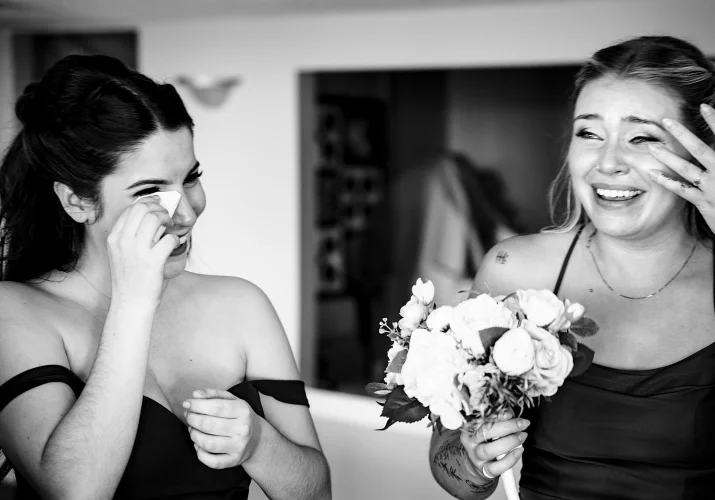 Bridesmaid cry and lough during the wedding in Calgary.