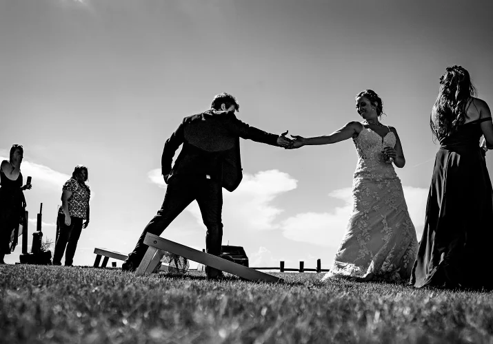 Bride and groom playing games and bet who will be the winner. Calgary Wedding.