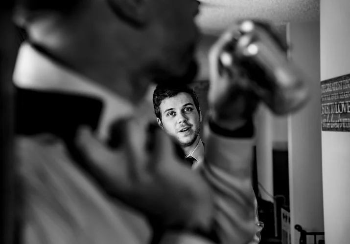 best-men's photograph through the hand of the man drinking a beer.