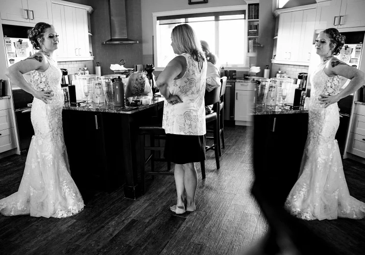 Photograph of the bride and her mother talking before the wedding ceremony in Calgary.