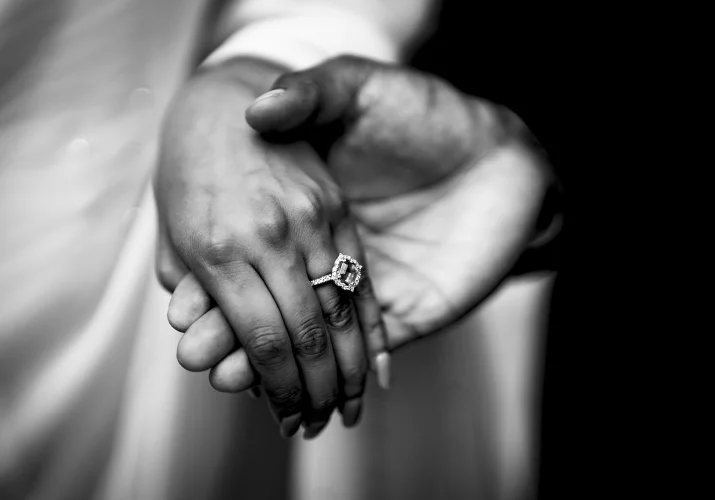 giant engagement ring on the finger.
