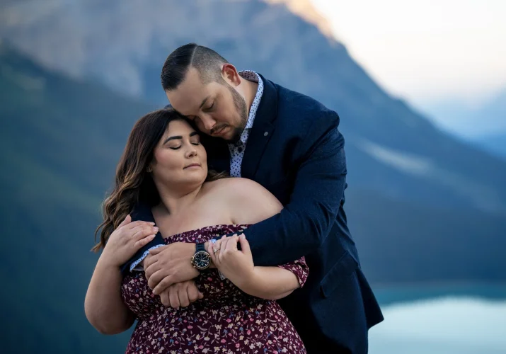 Intimate moment of hugging couple in love captured by the best Banff Wedding Photographer.