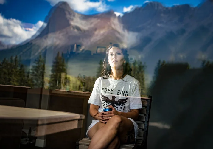 Photo through the window of the bride to be. In the window amazing reflection of the Canadian Rocky Mountains