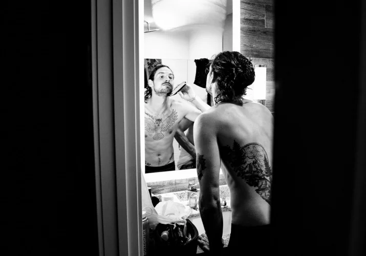 Groom shave in the washroom before Banff Wedding Ceremony.