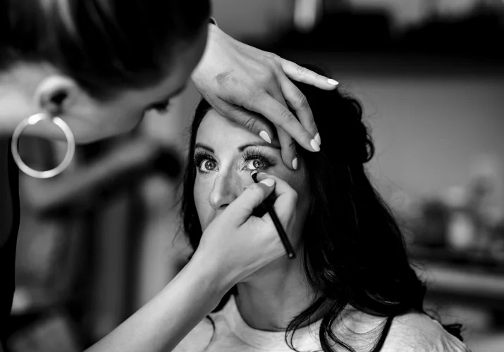 Make up artist put a make up on the bride before Banff Wedding Ceremony.