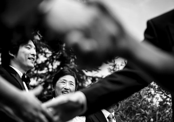 shoot through shaking hands or groom's Mather.