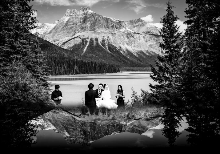 Creative wedding ceremony in the mountains with reflective effect created by the best Banff Wedding Photographers - 4Eyes Photography