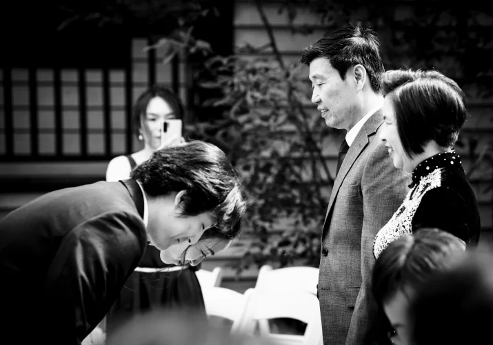 Newlyweds bowed to their parents after Banff Wedding Ceremony.