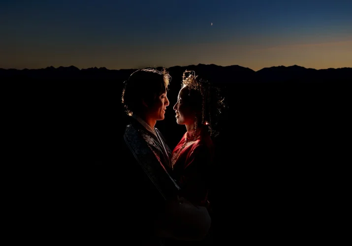 Back-lighted newlyweds looking at each other during the sunset in Banff.