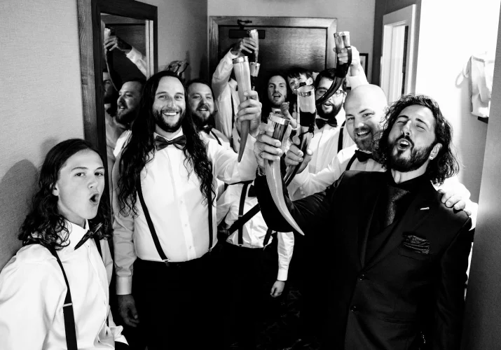broom and his friends make a toast in the hotel room before Banff Wedding Ceremony.