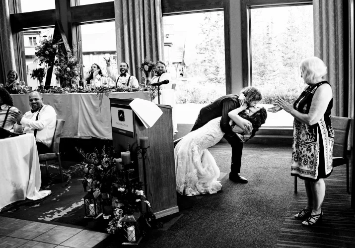 groom surprised the bride with passionate kiss during their speeches