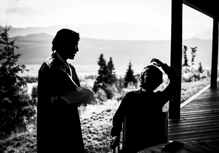 silhouetted talking to each other outside the Banff Wedding Reception.